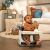 Baby sitting in Ingenuity Baby Base 2-in-1 Booster Seat with tray playing