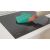 Cleaning Candy CTP644MCBB/1 induction cooktop with microfiber cloth