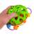 Hand holding the Owl Rattle Toy, showing the ball inside