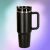 Termikus 1200ml black thermal mug with handle and straw on colorful background