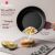 Berlinger Haus TitanPRO non-stick frying pan cooking fried egg