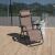 Pepita Zero Gravity Relax Chair on wooden deck, dark brown