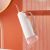 Oclean W10 Pink Water Flosser Hanging on Wall