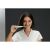 Woman brushing teeth with Oclean X Ultra 20S electric toothbrush