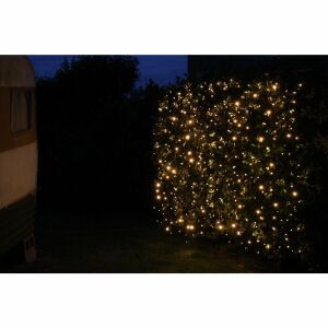 Flippy 5m x 2m meleg fehér LED függönylámpák egy bokorra szerelve egy kertben - Flippy