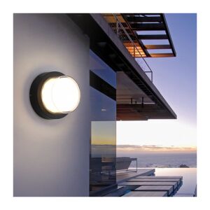 Aplică LED rotundă neagră pentru exterior, iluminând exteriorul unei case moderne - Lămpi de perete pentru exterior