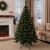 Pepita Classic Lux 1.3m artificial Christmas tree decorated in living room setting