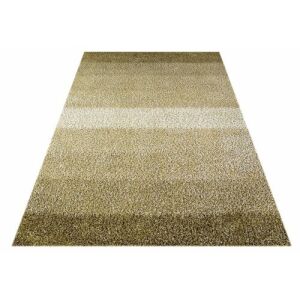 Schräge Ansicht des beigen Teppichs Bakero Shaggy Marmala 109, 140x140 cm - Wandpaneele & Wandaufkleber, Teppiche und Tischdecken