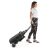 Woman pulling folded Chicco TROLLEYme stroller like luggage