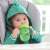Baby drinking from Chicco Training Cup 2in1, green chameleon design, with removable spout