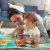 Mother and Baby Playing on Fisher-Price Play Mat