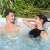 People relaxing in a Lay-Z-Spa inflatable hot tub with headrests