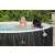 Couple relaxing in a Saluspa inflatable hot tub with headrests