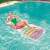 Woman relaxing on Bestway SMA 037 inflatable pool lounge chair