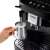 Close-up of DeLonghi Magnifica Evo coffee machine with milk frother