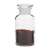 100ml glass bottle with wide mouth and ground glass stopper filled with red spice