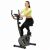Boldog nő használja az ActiHGet Actibike Pro szobakerékpárt otthon