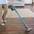 JIMMY JV85 cordless stick vacuum cleaner in use, cleaning a wooden floor