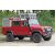 Piros Land Rover Defender snorkel és tetőcsomagtartóval