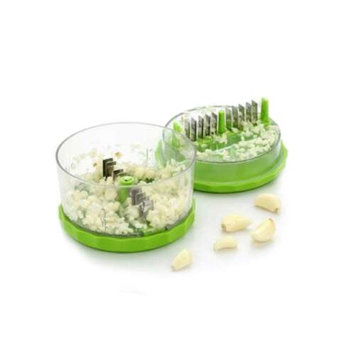 Green garlic press with stainless steel blades, garlic cloves and minced garlic