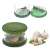 Green garlic press with stainless steel blades, garlic cloves and minced garlic