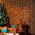 Home KIN 126C/WW LED curtain lights decorating a Christmas tree and gifts with somogyi.hu watermark