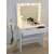 White dressing table with mirror and lights, showing the table in a room