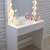 White dressing table with mirror and lights