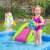 Child playing in Bestway inflatable pool with slide and astronaut, moon, rocket, and planet toys