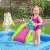 Child playing in Bestway inflatable pool with slide and astronaut, moon, rocket, and planet toys