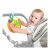 Bébi játszik a Winfun Fun Driver Junior kormánykerékkel, ami a babakocsira van rögzítve