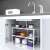 White adjustable kitchen shelf organizer, 2 tiers, metal and plastic, for under sink storage, in use