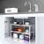 White adjustable kitchen shelf, 2 tier, metal and plastic, under sink storage, with pots and pans