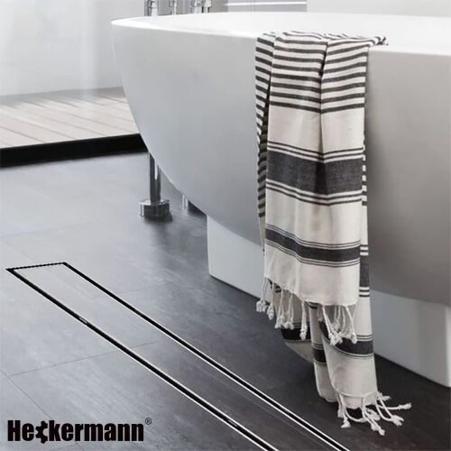 Heckermann 60cm ezüst lineáris zuhanyfolyóka beépítve egy modern fürdőszobában - Lefolyó