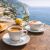 Eszpresszó és cappuccino asztalon tengerparti kilátással, Espressia Capri kávé