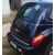 Kék Chrysler PT Cruiser ferde hátulnézete króm csomagtér díszléccel, kiemelve oldalsó profilját és a folyamatos króm vonalat