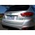 Ezüst Hyundai IX35 ferde hátulnézete a króm csomagtérajtó díszléccel és IX35 Highlander jelvénnyel, kültéri környezetben