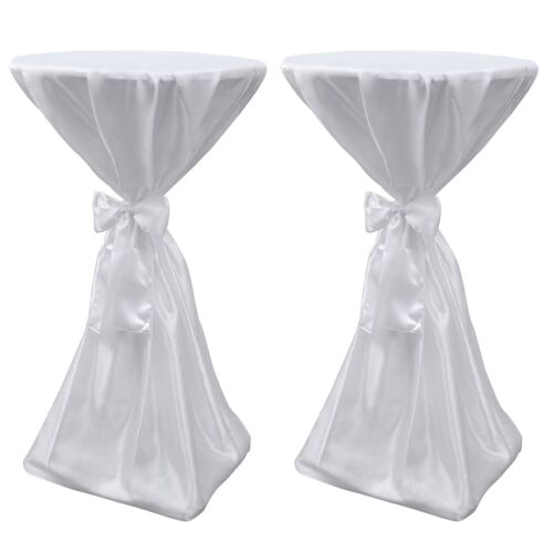 2 darabos szett fehér szatén terítőből szalaggal, 60 cm, kerek asztalokhoz, tökéletes koordinált rendezvénydekorációhoz, elölnézet - Party kellék