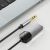 Tech-Protect UltraBoost mini jack 3.5mm Bluetooth audio adapter laptophoz csatlakoztatva, bemutatva kompakt méretét és vezeték nélküli audio felhasználását.