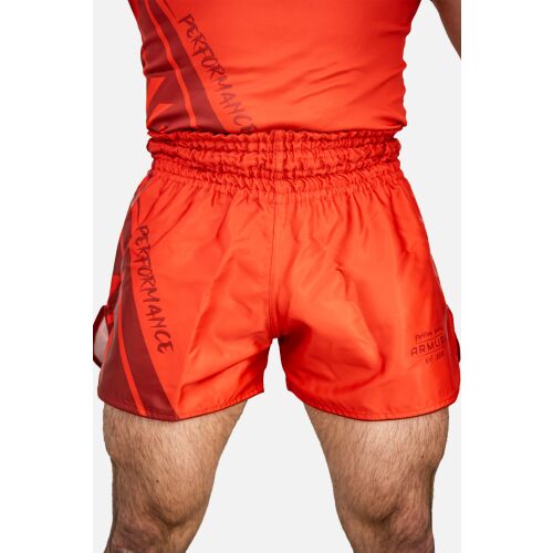 Rövid ARMURA Performance piros junior rövidnadrág harcművészetekhez, elölnézet egy férfi modellen, rugalmas derékrésszel és diszkrét márkajelzéssel - Harcművészeti ruházat