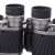 Close-up of 10x50 binoculars with black rubber coating and diopter adjustment