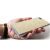 Kézben tartott arany csillogó Forcell Shining szilikon tok Apple iPhone 15 Pro Max-hoz, a tok hátoldalát és a portkivágásokat mutatva.