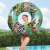Girl holding Bestway Floral Fantasy 114 cm inflatable swim ring with zebra and flamingo print