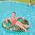 Girl using Bestway Floral Fantasy 114 cm inflatable swim ring with zebra and flamingo print