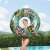 Girl holding Bestway Floral Fantasy 114 cm inflatable swim ring with zebra and flamingo print