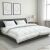 vidaXL Paplan és párna szett 3 db 200x200 cm 4 évszak 200+300 GSM modern hálószobai környezetben, fehér paplan és párnák sötét ágyon, semleges dekorációval, hangsúlyozva a kényelmet és stílust.