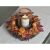 Autumn wreath centerpiece with candle holder, pumpkins, berries and leaves