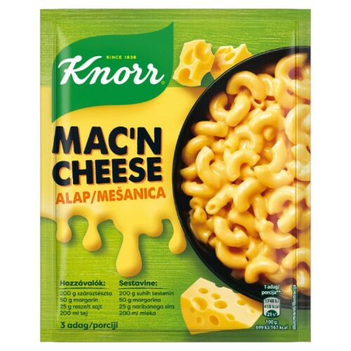 Knorr Mac'n Cheese alap, zöld és sárga tasak, melyen egy fekete tálban lévő makaróni és sajt, sajtszeletek és gazdag sajtos szósz látható, kiemelve a gyors étel egyszerű elkészítését. - Ételalap