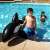 Bestway Giant Killer Whale Rider, inflatable pool toy, black and white, 203x102 cm, in pool, child riding
