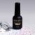 LUXORISE Diamond Finish fedőlakk 15ml flakon egy nagy gyémánttal és szórt csillámokkal szürke színátmenetes háttérrel, kiemelve a gyémántszerű fényt